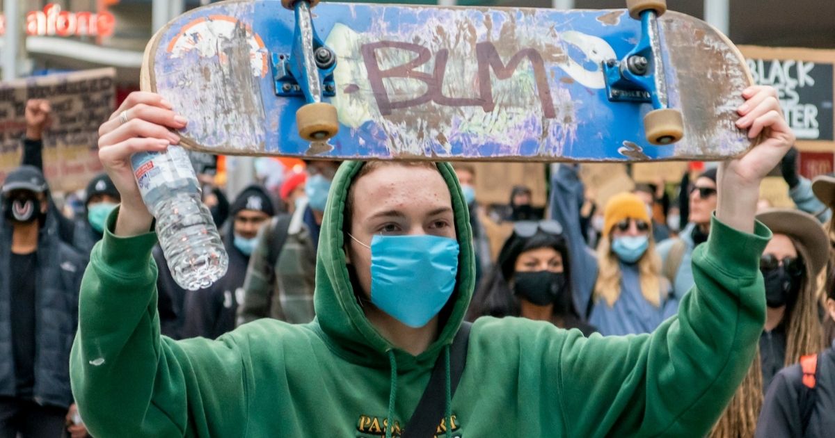 BLM written on skateboard at rally