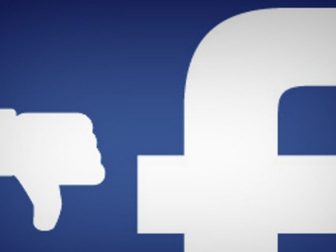 Close Up of Facebook F with Thumb Down