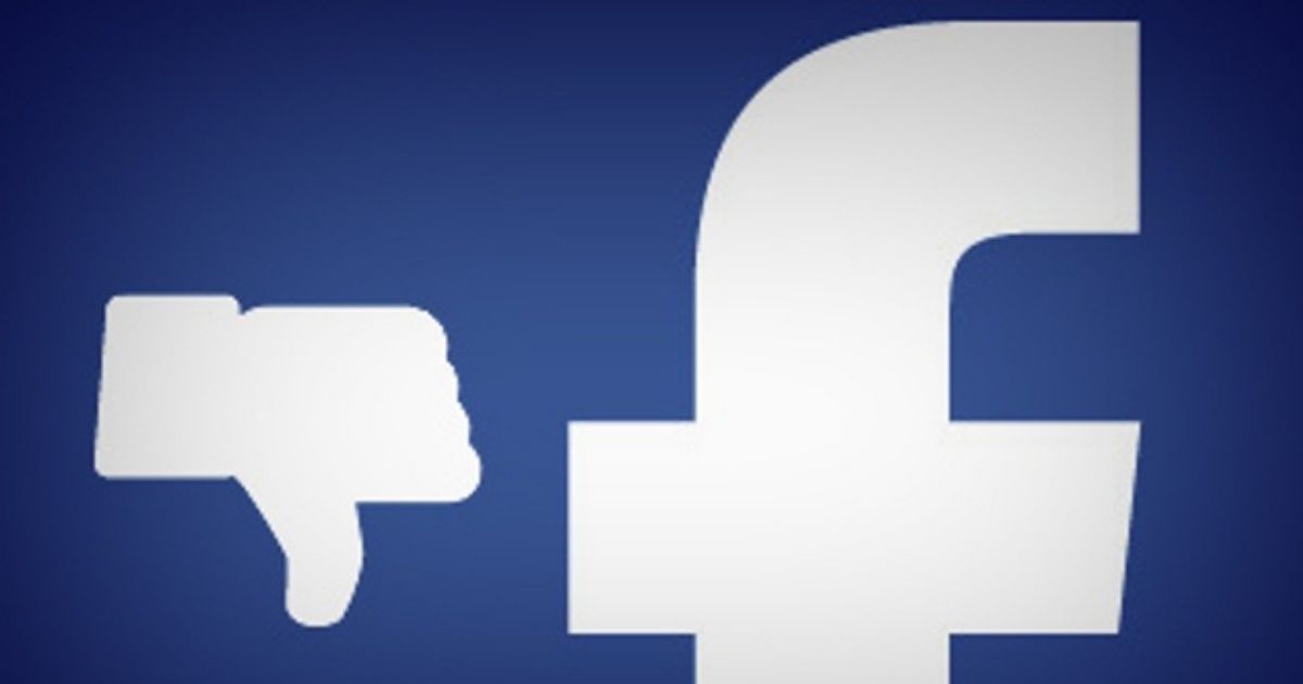 Close Up of Facebook F with Thumb Down