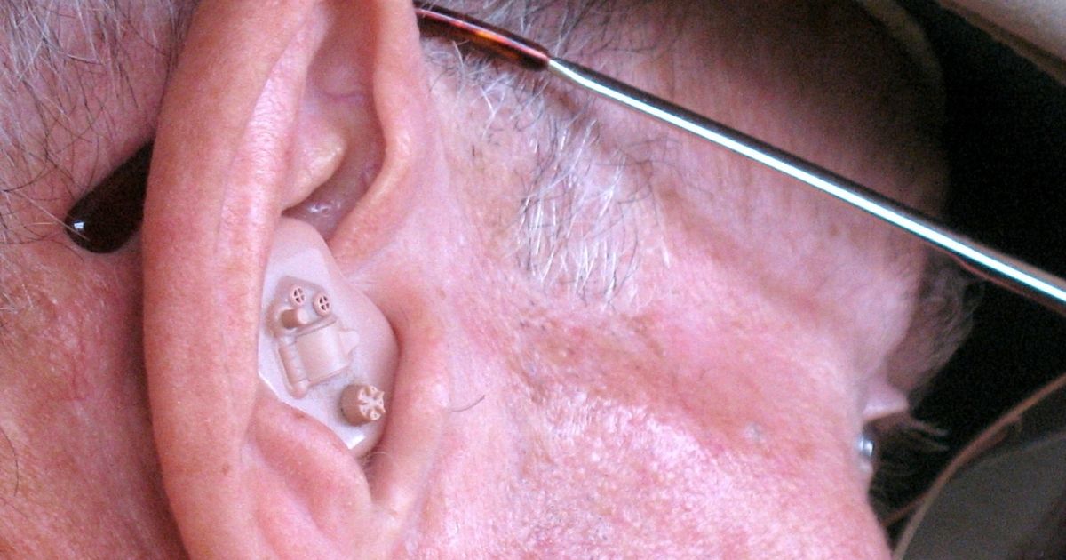 Close up of hearing aid in ear