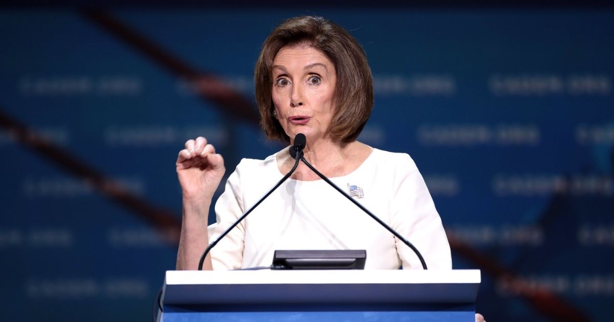 House Speaker Nancy Pelosi speaking from podium