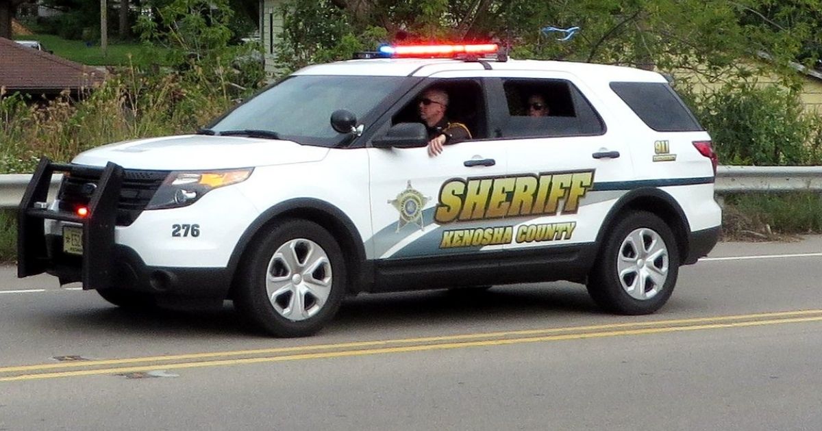 Kenosha County Sheriff SUV driving down street