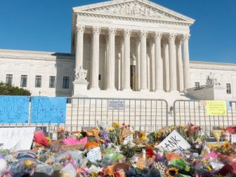 Flowers left as a memorial to Ruth Bader Ginsburg in front of SCOTUS