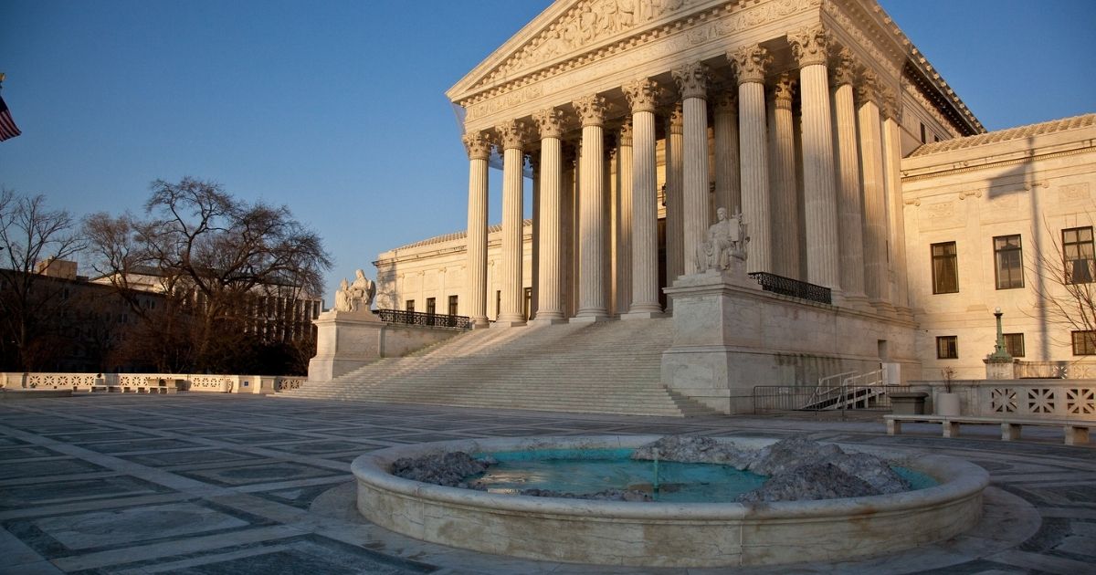 SCOTUS building with fountain out front