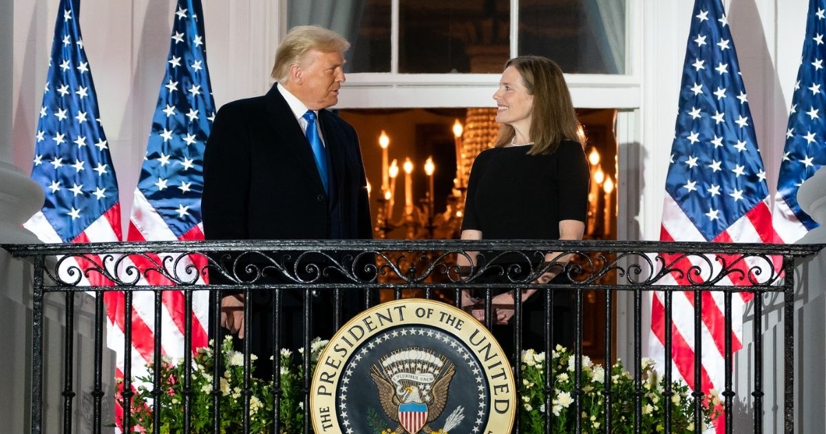 President Donald J. Trump and U.S. Supreme Court Associate Justice Amy Coney Barrett stand together on the Blue Room balcony Monday, Oct. 26, 2020, following Justice Barrett’s swearing-in ceremony on the South Lawn of the White House. (Official White House Photo by Andrea Hanks)