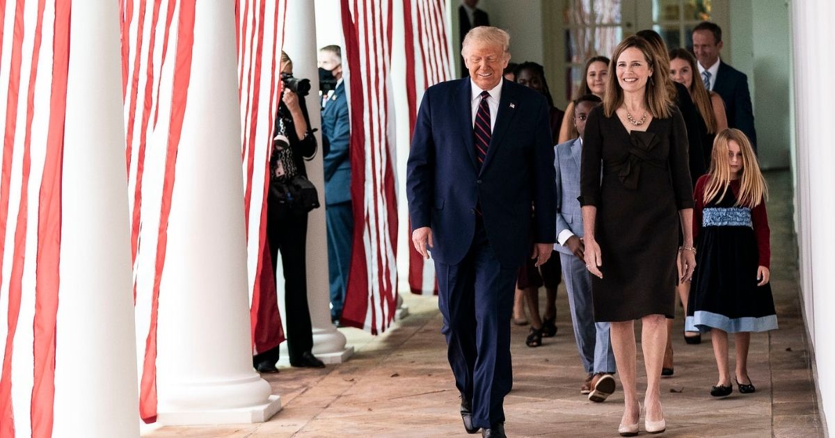 resident Donald J. Trump walks with Judge Amy Coney Barrett, his nominee for Associate Justice of the Supreme Court of the United States, along the West Wing Colonnade on Saturday, September 26, 2020, following announcement ceremonies in the Rose Garden. (Official White House Photo by Shealah Craighead)