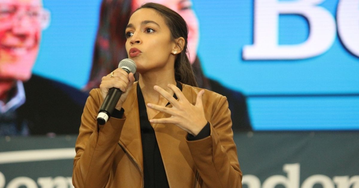 Rep. Alexandria Ocasio-Cortez speaking to attendees at a rally for Bernie Sanders in Council Bluffs, Iowa. Please attribute to Matt A.J. if used elsewhere.