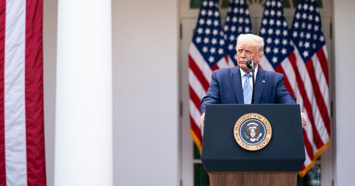 President Donald J. Trump listens as Vice President Mike Pence addresses his remarks during an update on the nation’s COVID-19 Coronavirus testing strategy Monday, Sept. 28, 2020, in the Rose Garden of the White House. (Official White House Photo by Shealah Craighead)