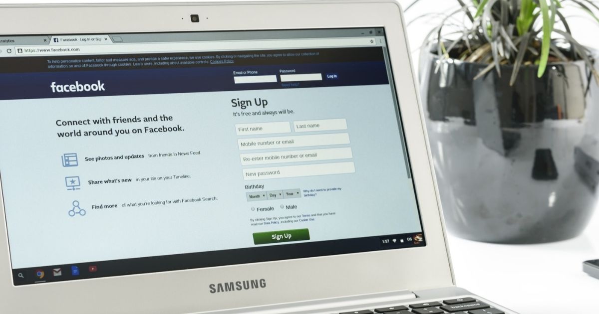 Facebook login page on a laptop computer.