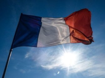 French flag flying on a sunny day