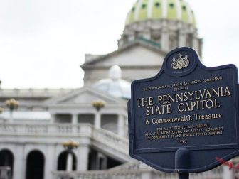 Pennsylvania State Capitol signage wtih capitol building in background