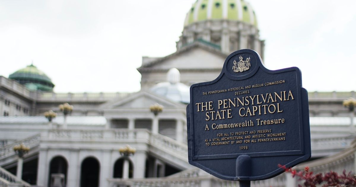 Pennsylvania State Capitol signage wtih capitol building in background