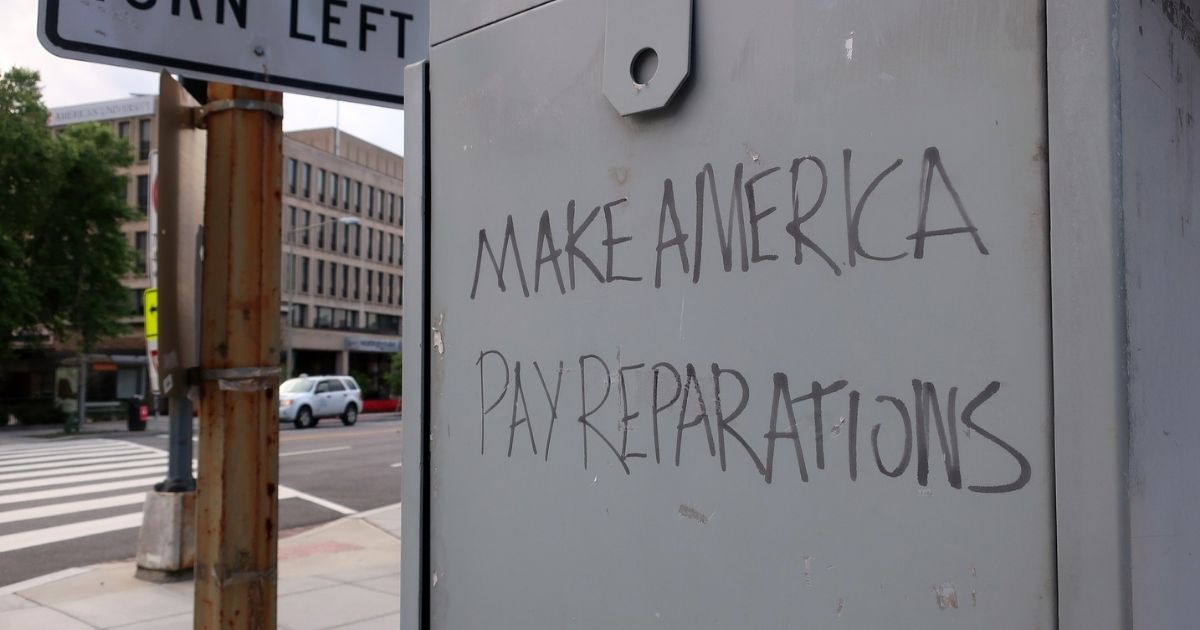 "Make America Pay Reparations" graffiti
