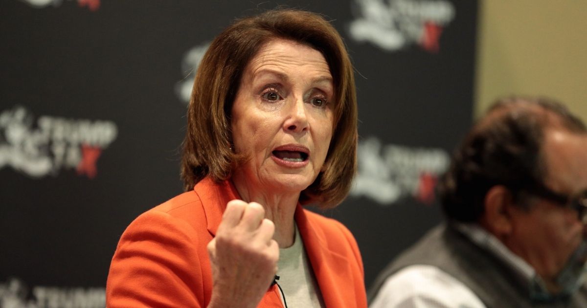 Minority Leader Nancy Pelosi speaking with attendees at a Trump Tax Town Hall hosted by Tax March at Events on Jackson in Phoenix, Arizona.