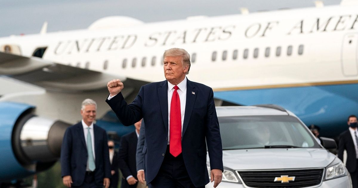President Donald J. Trump gestures with a fist pump as he disembarks Air Force One Tuesday, Sept. 8, 2020, at the Greensboro/High Point Airport for his visit to Winston-Salem, N.C. (Official White House Photo by Joyce N. Boghosian)