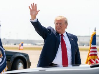 President Donald J. Trump applauds and waves as he acknowledges crowds waiting on the flight line after disembarking Air Force One Wednesday, Aug. 21. 2019, at Louisville International Airport in Louisville, KY. (Official White House Photo by Shealah Craighead)