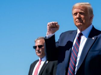 President Donald J. Trump gestures with a fist-pump as he disembarks Air Force One at Wilkes-Barre Scranton International Airport in Avoca, Pa., Thursday, August 20, 2020, and Is greeted by guests and supporters. (Official White House Photo by Tia Dufour)