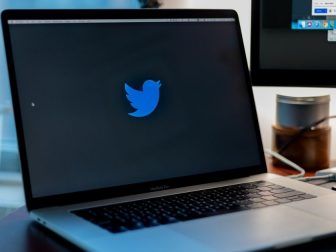 Twitter logo on the screen of a laptop
