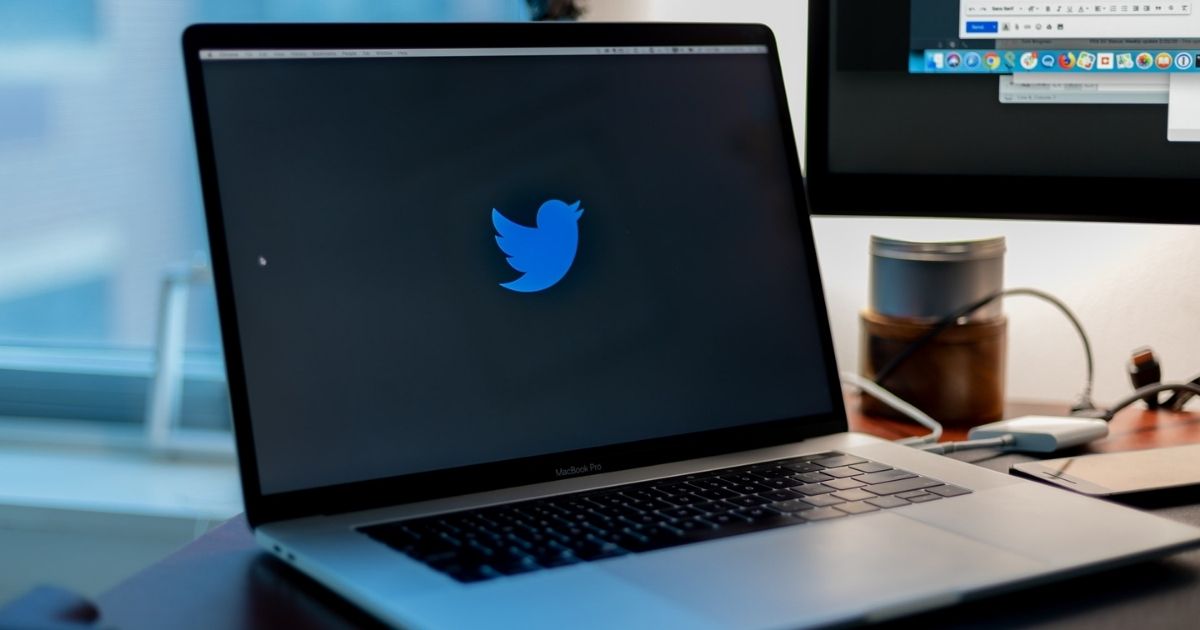 Twitter logo on the screen of a laptop
