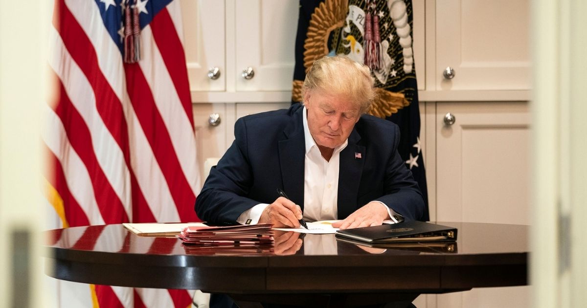 President Donald J. Trump works in the Presidential Suite at Walter Reed National Military Medical Center in Bethesda, Md. Saturday, Oct. 3, 2020, after testing positive for COVID-19 on Thursday, Oct. 1, 2020. (Official White House Photo by Joyce N. Boghosian)