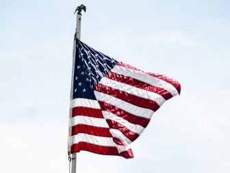 American flag flying in the wind.