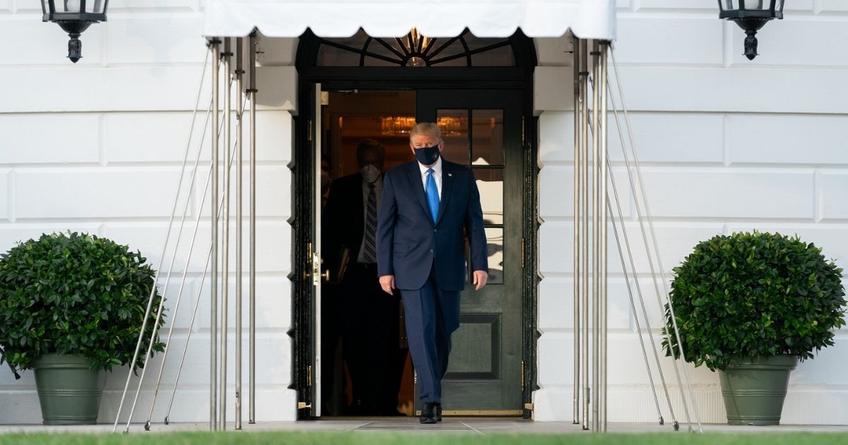 President Donald J. Trump walks across the South Lawn of the White House and boards Marine One Friday, Oct. 2, 2020, en route to Walter Reed National Military Medical Center in Bethesda, Md. (Official White House Photo by Andrea Hanks)