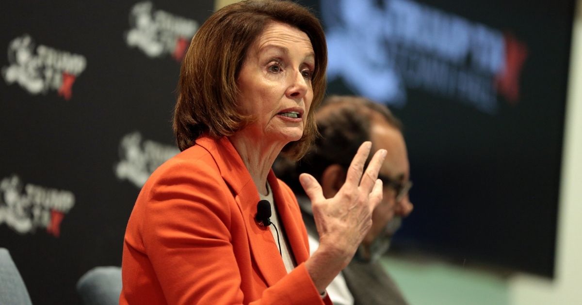 Minority Leader Nancy Pelosi speaking with attendees at a Trump Tax Town Hall hosted by Tax March at Events on Jackson in Phoenix, Arizona.