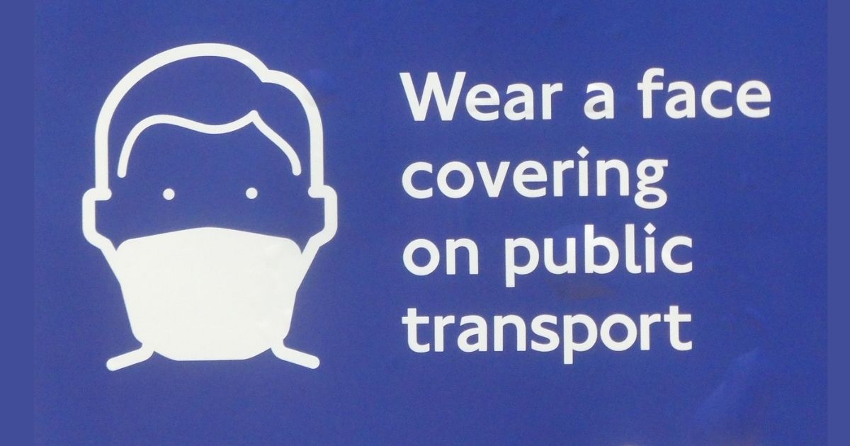 Wear a face covering on public transport sign