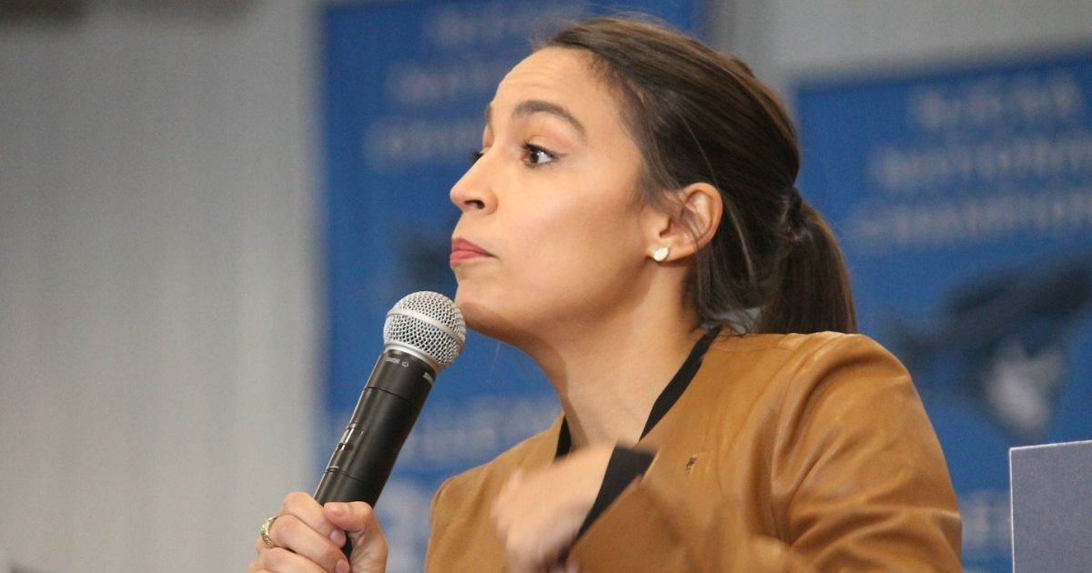 Rep. Alexandria Ocasio-Cortez speaking to attendees at a rally for Bernie Sanders in Council Bluffs, Iowa.