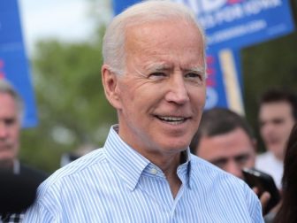 Former Vice President of the United States Joe Biden walking with supporters at a pre-Wing Ding march from Molly McGowan Park in Clear Lake, Iowa.