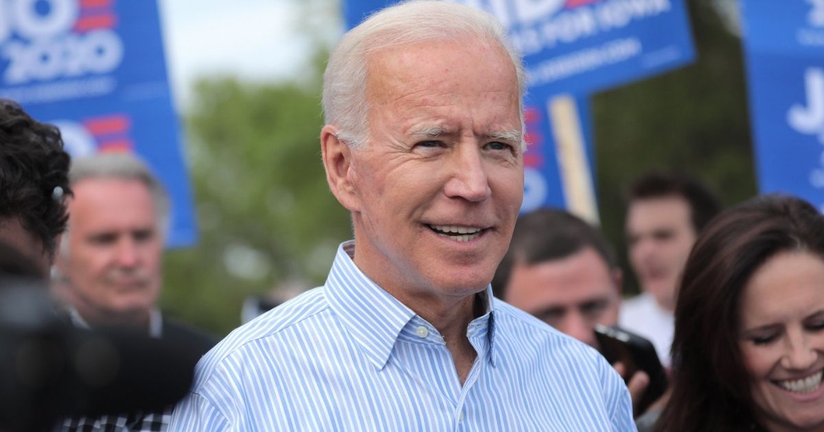 Former Vice President of the United States Joe Biden walking with supporters at a pre-Wing Ding march from Molly McGowan Park in Clear Lake, Iowa.