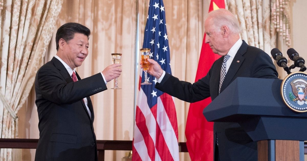 With U.S. Secretary of State John Kerry looking on, U.S. Vice President Joe Biden raises his glass to toast Chinese President Xi Jinping at a State Luncheon in the Chinese President's honor at the U.S. Department of State in Washington, D.C., on September 25, 2015. [State Department photo/ Public Domain]