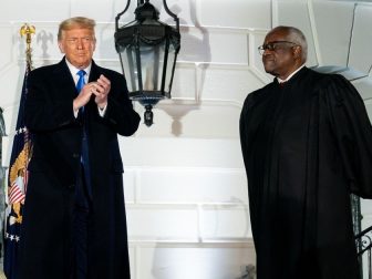 President Donald J. Trump, joined by associate U.S. Supreme Court Justice Clarence Thomas, applauds Amy Coney Barrett following her swearing-in as Associate Justice of the U.S. Supreme Court Monday, Oct. 26, 2020, on the South Lawn of the White House. (Official White House photo by Tia Dufour)