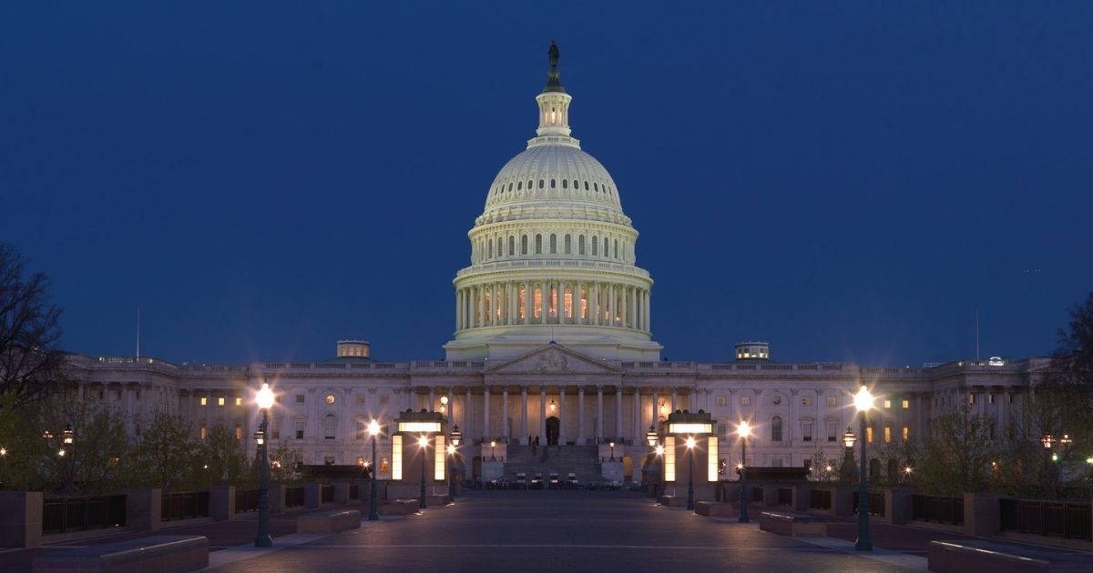 The East Front of the U.S. Capitol Building at night.