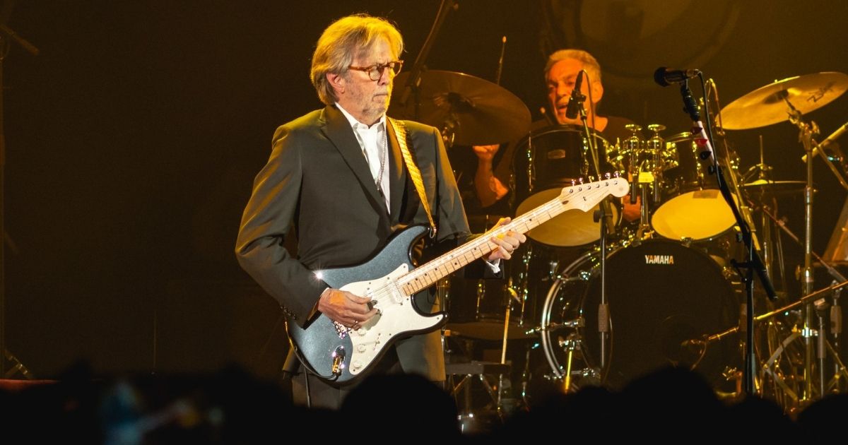 Eric Clapton playing guitar in concert