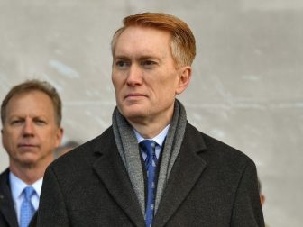 Sen. James Lankford (R-OK) stands for the parading of the colors during the commissioning ceremony of littoral combat ship USS Tulsa (LCS 16). LCS 16 is the fifteenth littoral combat ship to enter the fleet and the eighth of the Independence variant.