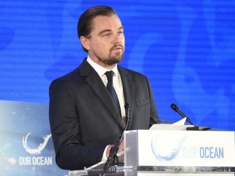 U.S. Secretary of State John Kerry watches actor and environmentalist Leonardo DiCaprio on September 15, 2016, as he addressed the third Our Ocean Conference at the U.S. Department of State in Washington, D.C.