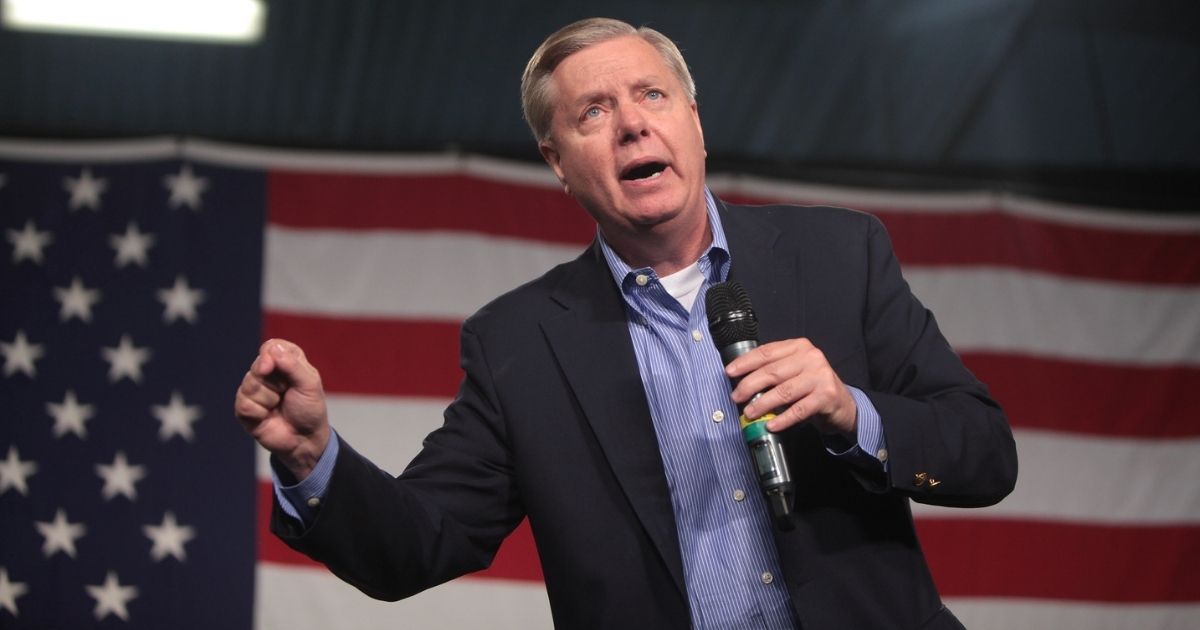 U.S. Senator Lindsey Graham speaking with attendees at the 2015 Iowa Growth & Opportunity Party at the Varied Industries Building at the Iowa State Fairgrounds in Des Moines, Iowa.