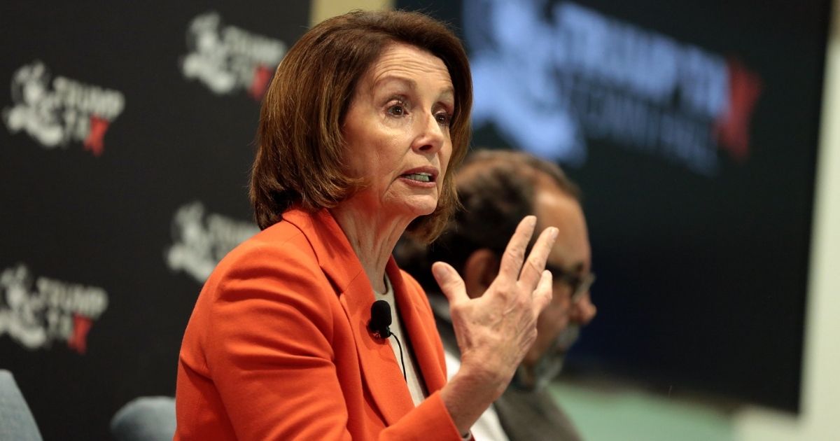 Minority Leader Nancy Pelosi speaking with attendees at a Trump Tax Town Hall hosted by Tax March at Events on Jackson in Phoenix, Arizona.