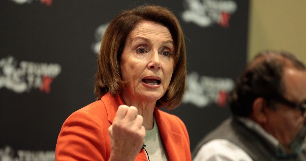 Minority Leader Nancy Pelosi speaking with attendees at a Trump Tax Town Hall hosted by Tax March at Events on Jackson in Phoenix, Arizona.