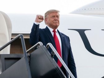 President Donald J. Trump offers a fist-pump to an awaiting crowd as he steps from Air Force One Friday, Aug. 28, 2020, upon his arrival to Manchester-Boston Regional Airport in Manchester, N.H. (Official White House Photo by Joyce N. Boghosian)