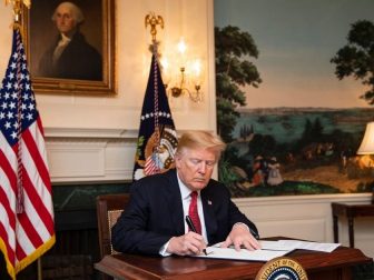 President Trump signing paperwork in the WH