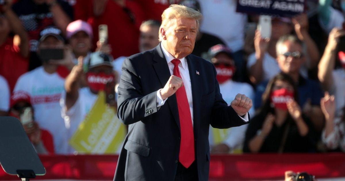 President of the United States Donald Trump dancing at the conclusion of a "Make America Great Again" campaign rally at Phoenix Goodyear Airport in Goodyear, Arizona.