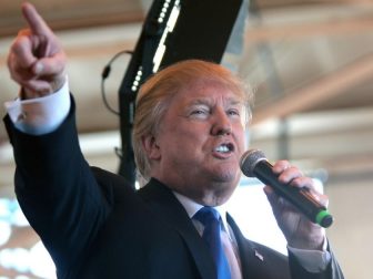 Donald Trump speaking with supporters at a hangar at Mesa Gateway Airport in Mesa, Arizona.