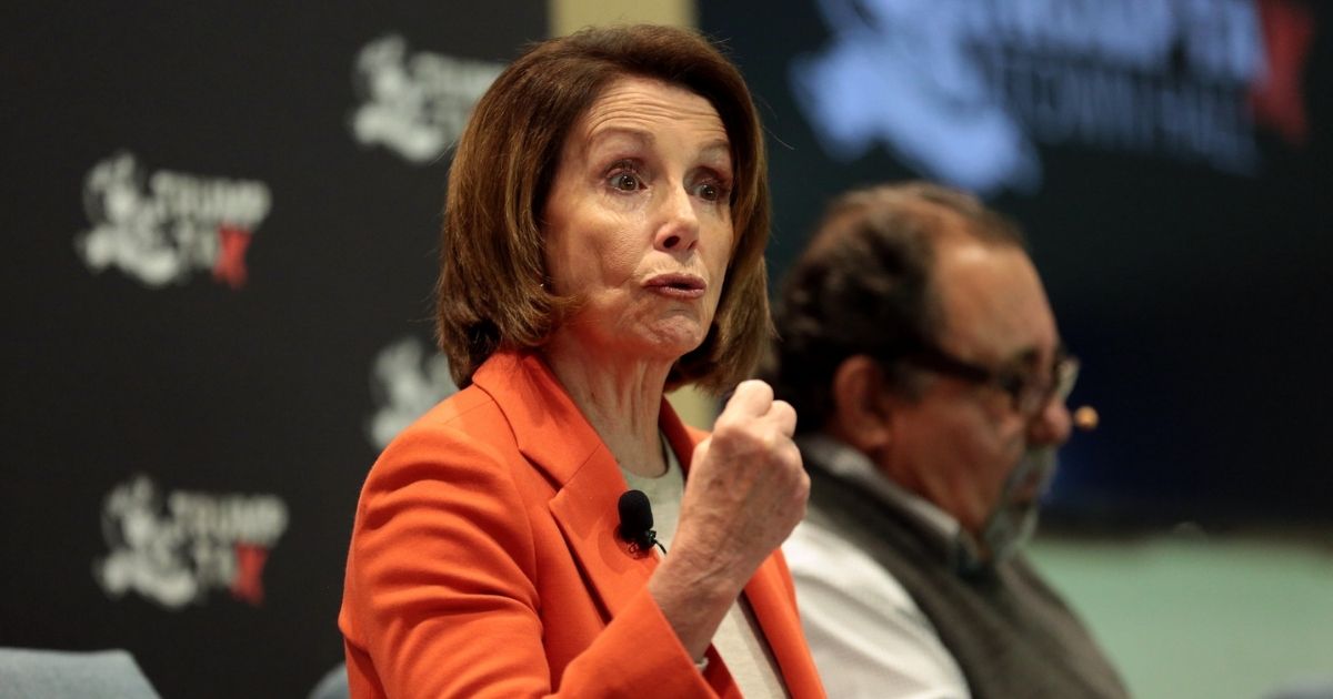 Minority Leader Nancy Pelosi speaking with attendees at a Trump Tax Town Hall hosted by Tax March at Events on Jackson in Phoenix, Arizona.