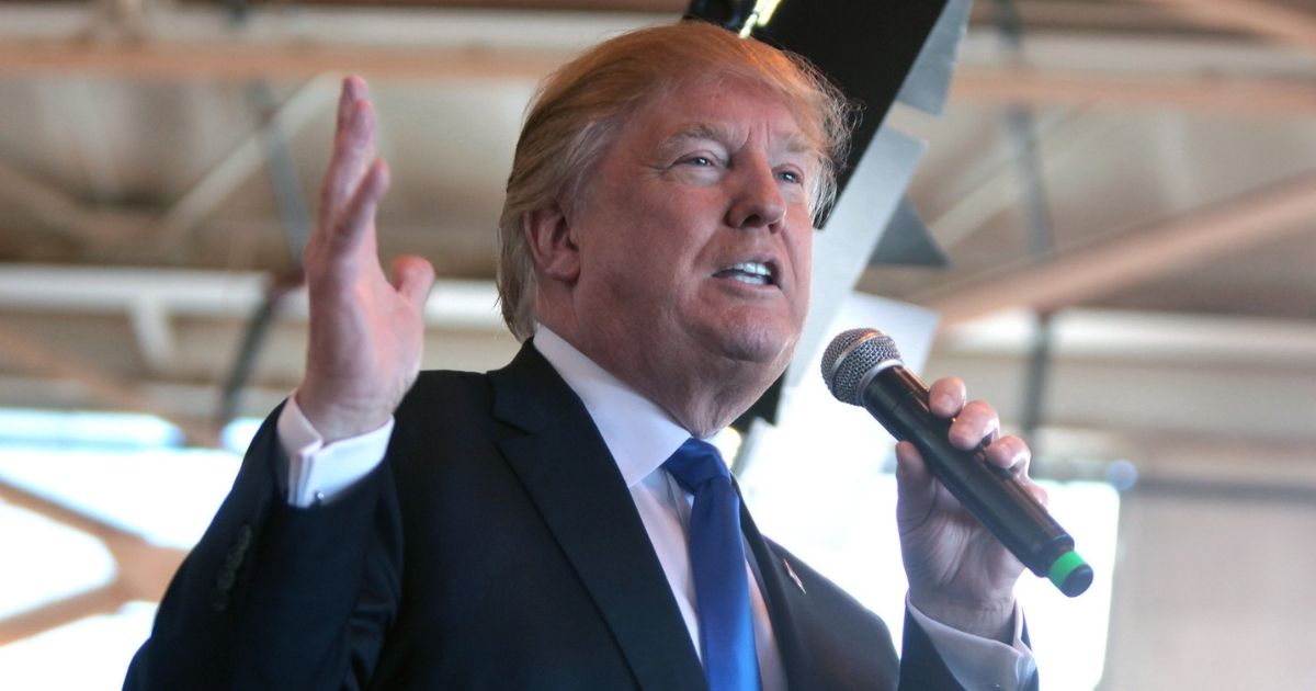 Donald Trump speaking with supporters at a hangar at Mesa Gateway Airport in Mesa, Arizona.