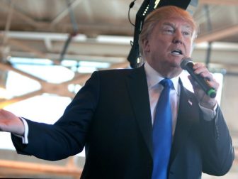 Donald Trump speaking with supporters at a hangar at Mesa Gateway Airport in Mesa, Arizona.