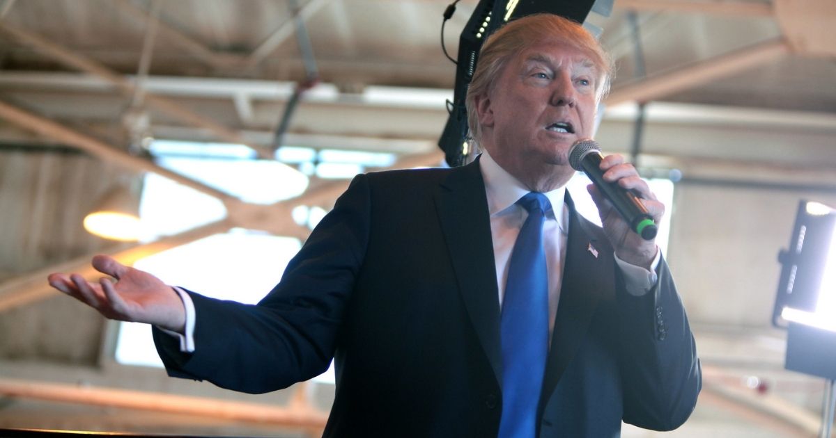 Donald Trump speaking with supporters at a hangar at Mesa Gateway Airport in Mesa, Arizona.