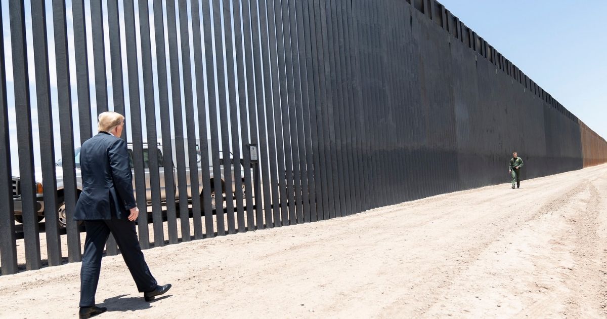 President Donald J. Trump walks along the completed 200th mile of new border wall Tuesday, June 23, 2020, along the U.S.-Mexico border near Yuma, Ariz. (Official White House Photo by Shealah Craighead)