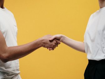 People making handshake as a sign of success